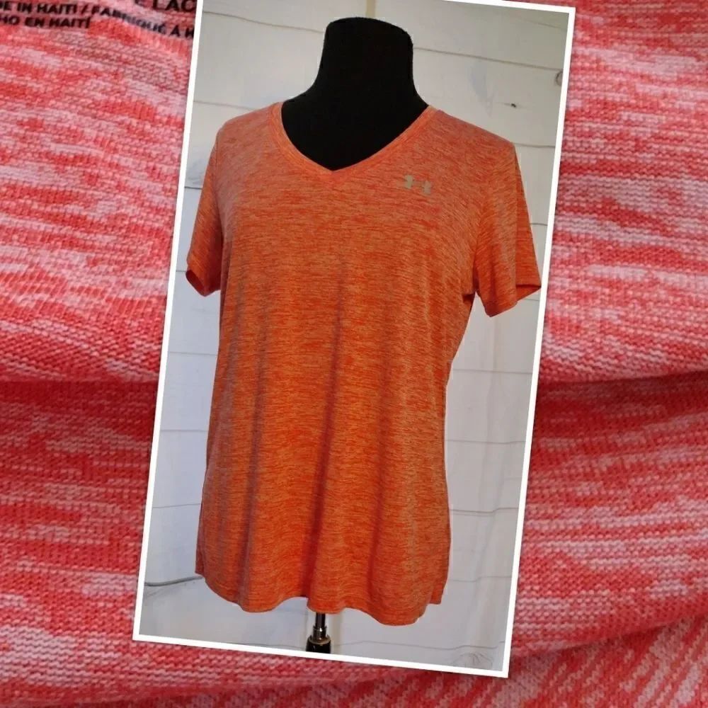 Under Armor Large v neck coral t-shirt. Silver UA logo on the left.